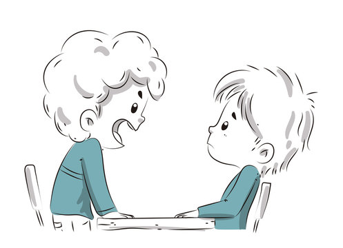 Ni&ntilde;os enfadados discutiendo sentados en una mesa