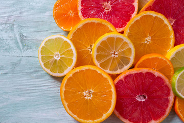 citrus fruit slices on turquoise background