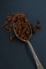 molasses sugar in a spoon