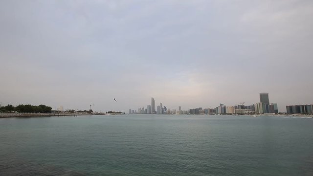 Abu Dhabi skyline in a cloudy day. Establishing shot.