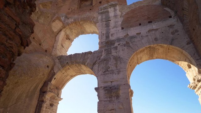Roman Colosseum interior arch shows architectural details in Rome, Italy
