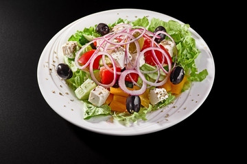 Closeup of Greek Salad on black background