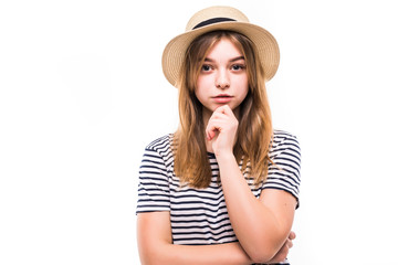 Attractive hipster fashion teen girl in hat thinking isolated on white background