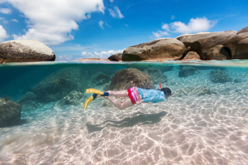 Fototapeta na wymiar Woman snorkeling in tropical water