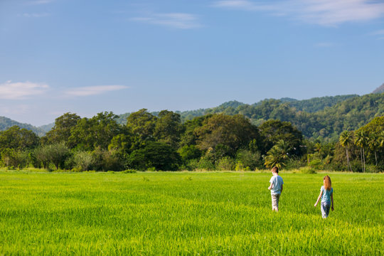 Kids walking in rice field