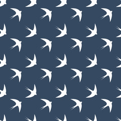 Seamless dark blue swallows pattern vector