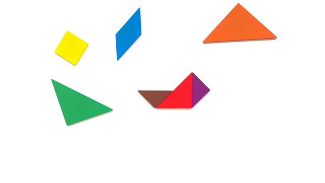 wooden tangram shaped like jet and plane and rocket and bomb and train on white