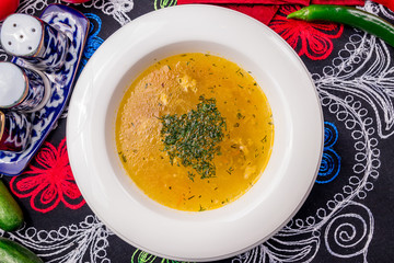 Chicken soup bouillon in a plate