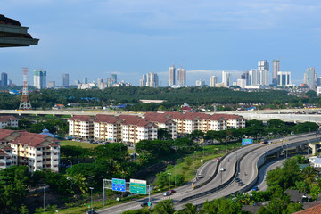High angle view of Johor Bahru's cityscape with highway and skyline in the afternoon