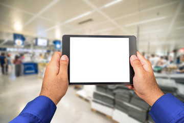 Fototapeta na wymiar technician hold empty tablet screen on blur DIY cashier slot