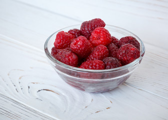 healhty breakfast or meal on white wooden table with cottage cheese and berries