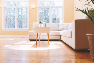 White sectional couch in a large luxury interior home