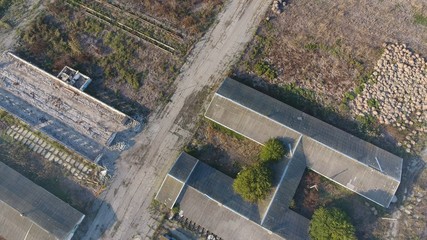 The building of an old farm for cattle. Top view of the farm. Storage of bales of hay on the old farm