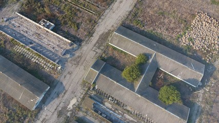 The building of an old farm for cattle. Top view of the farm. Storage of bales of hay on the old farm