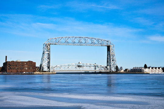 Duluth Minnesota aerial lift bridge with ice on sunny day
