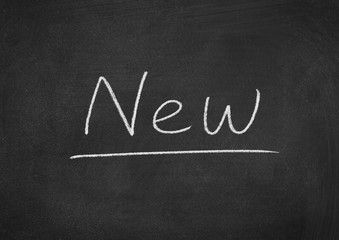 Obraz premium new concept word on a blackboard background
