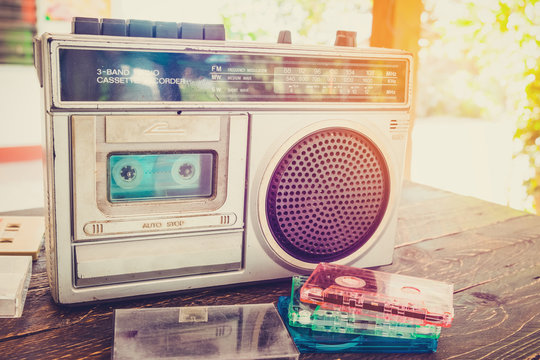 Retro lifestyle - tape cassette with cassette player and recorder for listen music - vintage color tone effect.