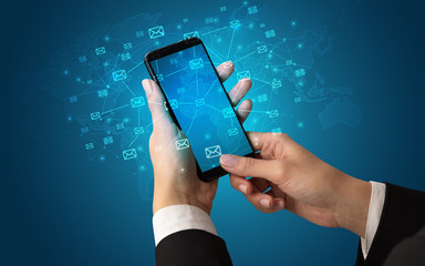 Female hand using smartphone with cloud, message and global concept
