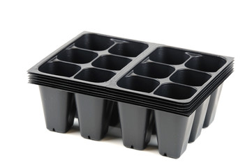 black plastic seedling tray isolated on white background