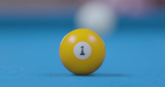 Close Up of Hitting Pool Ball on Blue Billiards Table - Slow