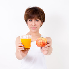 Beautifulyoung Asia woman with healthy food. Isolated on white background. Studio lighting. Concept for healthy.