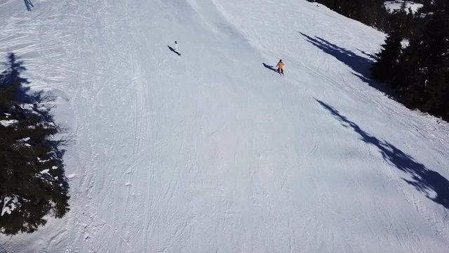  4k.Aerial. Skiers silhouettes. Winter ski rest time.

