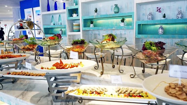Buffet with fresh dishes at the catered buffet table decorated beautiful. slow motion. 1920x1080