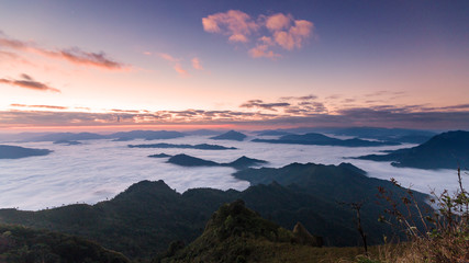 Fototapeta na wymiar Beautiful Sunrise of travel place with morning mist at Phu chi dao/Phu chee dao in Chiangrai,Thailand