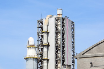 Refinery tower in petrochemical industrial plant with cloudy sky