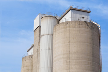 old cement silos and blue sky background