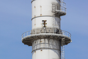 Pipes of industrial factory and blue sky background