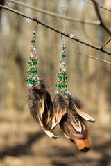 earrings of handmade dream catcher with feathers threads and beads rope hanging
