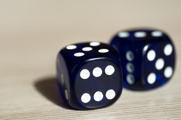 Blue gambling dice on table