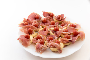 Christmas appetizer with tomatoes and ham bread