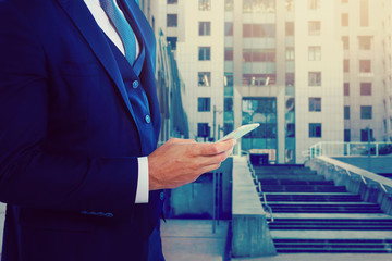 Close up of a man using mobile smart phone