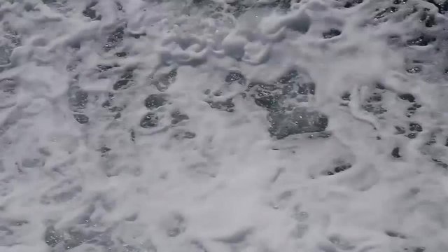 Video sea water and foam outside the ship