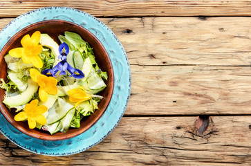 Fresh vegan salad with edible flowers