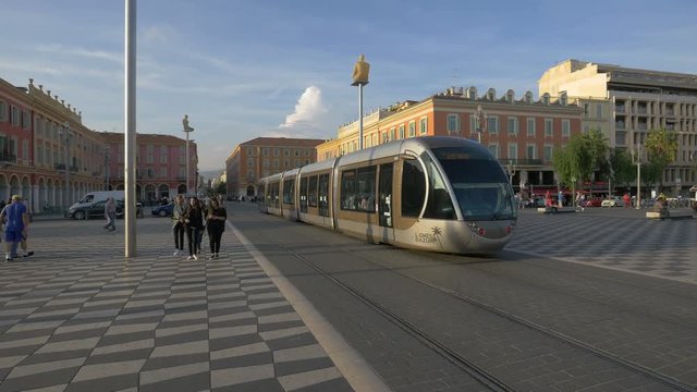 A tram rolling in a city square