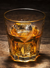 glass of alcohol drink with ice