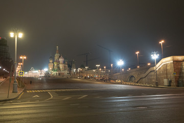 Fototapeta na wymiar Night Moscow image. Cloudy. Night lights of city do colorful the night in Moscow. Temple of Vasily Blazhenny view / Cathedral of St. Basil the Blessed view
