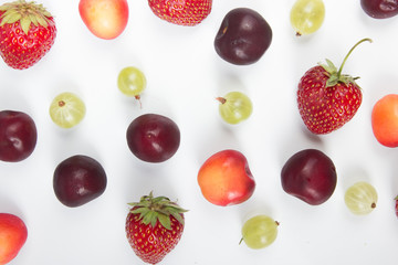 Various summer Fresh berries in a white background.. Antioxidants, detox diet, organic fruits. Top view. Berries