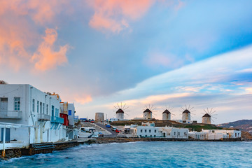 Famous view wiht traditional windmills on the island Mykonos, The island of the winds, at cloudy...