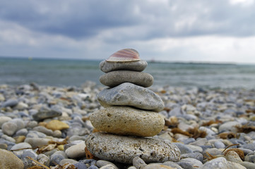Small zen stone tower on the beach