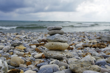 Small zen stone tower on the beach