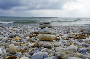 Fototapeta na wymiar Small zen stone tower on the beach