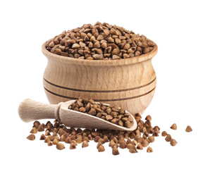 Buckwheat in wooden bowl isolated on white background