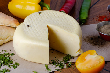 Head of cheese with bread, tomato, pepper, spices and herbs