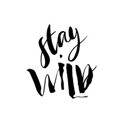 Stay Wild. Calligraphy motivation card with quote. Hand drawn design elements. Handwritten modern brush lettering. Vector illustration.