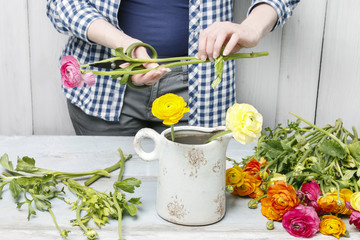 Woman working with spring flowers.