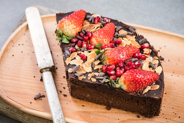 Slice of healthy brownie with strawberry